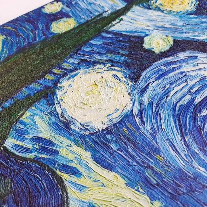 Close-up of a textured artwork featuring swirling blue and white patterns, reminiscent of a starry night sky.